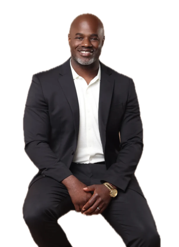 John Lewis in a black suit, smiling
